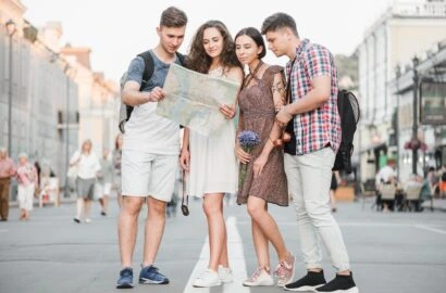 young-people-standing-street-discovering-city-map-2-410x270